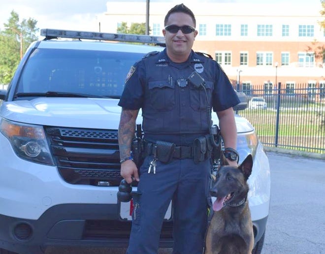 Joey Mulero was fired as a DeLand police officer Monday for excessive use of force and not having probable cause to make an arrest. He's shown with K-9 Officer Ruso. [DeLand Police Department via Facebook]