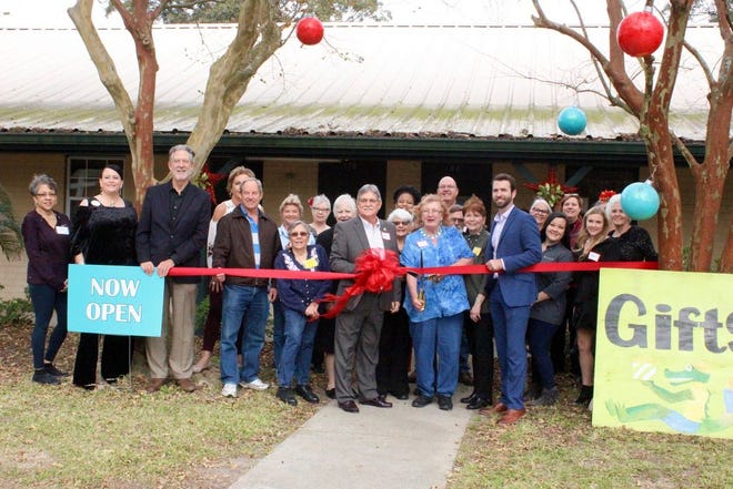 Members of the River Region Art Association, the Ascension Chamber, Gonzales Council, friends, and family line up the celebrate the ribbon cutting.
