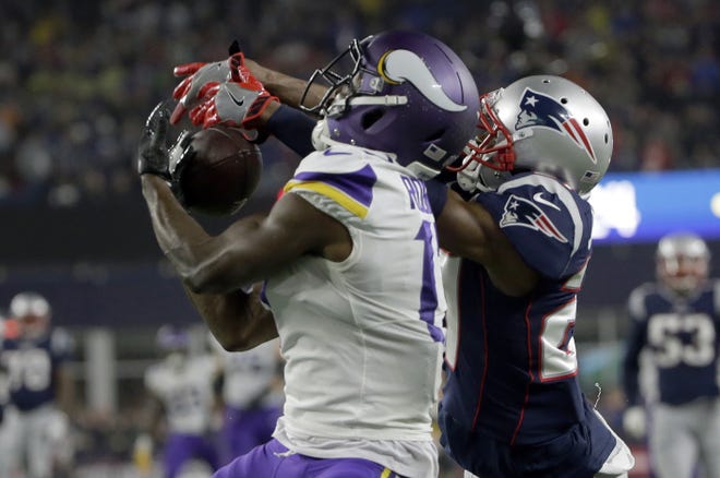 Patriots defensive back J.C. Jackson (right) breaks up a pass intended for Minnesota Vikings wide receiver Aldrick Robinson during the second half of New England's win on Sunday at Gillette Stadium. [AP Photo/Steven Senne]