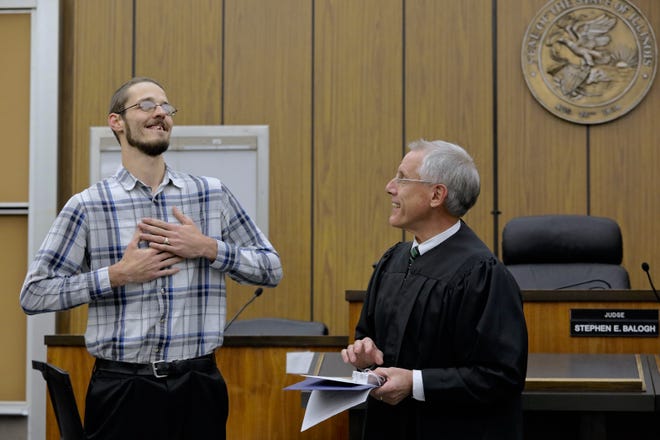 Aaron Hayford, left, did two tours of duty in Afghanistan and suffered from symptoms of post-traumatic stress disorder when he returned to Winnebago County. On Monday, Dec. 3, 2018, Judge Stephen Balogh commended Hayford as he graduated from Veterans Court. [SUSAN MORAN/RRSTAR.COM CORRESPONDENT]