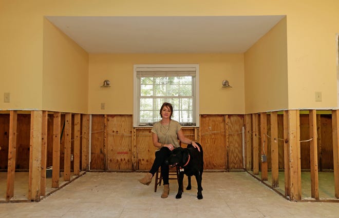 Danielle Rees has repairs underway in her home near Washington, N.C., after about 15 inches of water from Hurricane Florence flowed into her home in September. [AP Photo / Gerry Broome]