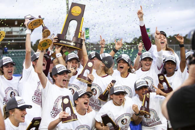 Florida State celebrates their victory over North Carolina in the NCAA women's soccer championship game in Cary, N.C., Sunday. [BEN MCKEOWN/AP PHOTO]