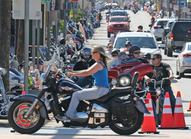 Bikers cruise Main Street on opening day of Biketoberfest 2018. Despite the motorcycle rally, occupancy figures for area hotels were down 8 percent year-over-year in October. [News-Journal/Nigel Cook]