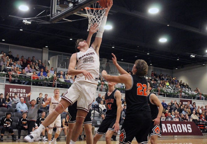 Holland Christian's Gabe Overway sinks a reverse layup in the first half of the Maroons re-opening of the Civic Center in a win over Middleville on Tuesday, Dec. 4, 2018. [Chris Zadorozny/Sentinel staff]