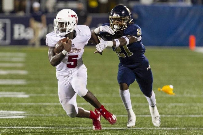 Florida Atlantic running back Devin Singletary (5), one of three Owls named to the All-Conference USA first team on Tuesday, ran for nearly 1,400 yards and an FBS-best 22 touchdowns this season. [MATIAS J. OCENER/Miami Herald]
