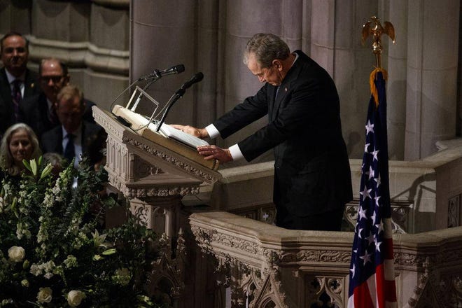 Former President George W. Bush fights back tears as he speaks during the State Funeral for his father, former President George H.W. Bush, at the National Cathedral, Wednesday, Dec. 5, 2018, in Washington. (AP Photo/Evan Vucci)