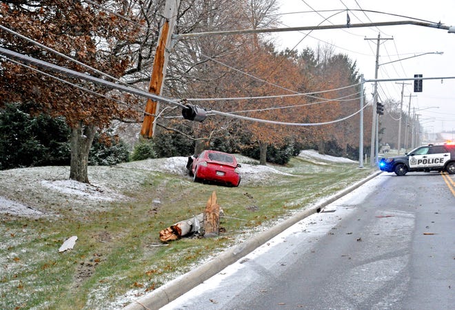A two-car crash Wednesday morning downed lines and utility poles, causing the closure of Route 83 southbound between Smithville-Western and Riffel roads.