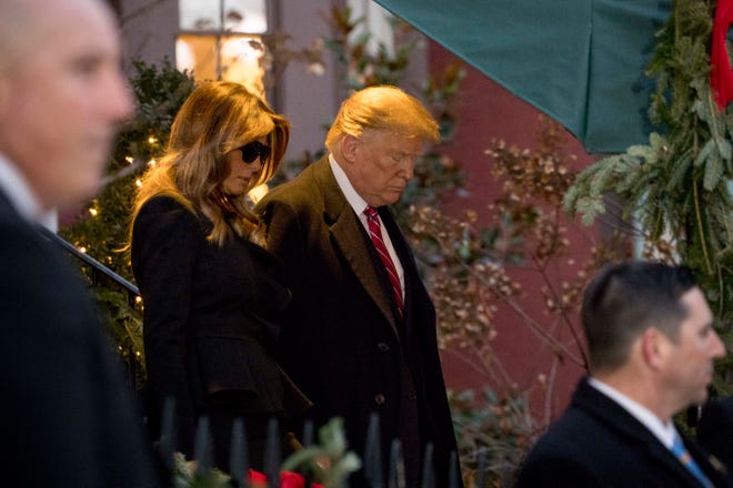 President Donald Trump and first lady Melania Trump leave Blair House after visiting with the family of former President George H. W. Bush, Tuesday, Dec. 4, 2018, in Washington. (AP Photo/Andrew Harnik)