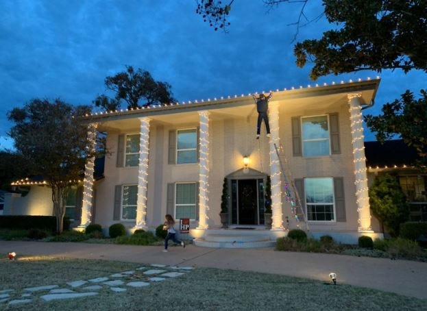 This Clark Griswold dummy hanging from the roof of an Austin, Texas, home is part of the family's Christmas decorations. [PHOTO VIA WASHINGTON POST]