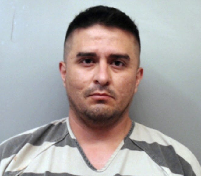 FILE - This file photo provided by the Webb County Sheriff's Office shows U.S. Border Patrol agent Juan David Ortiz. Ortiz, who confessed to shooting four women in the head and leaving their bodies on rural Texas roadsides, was indicted Wednesday, Dec. 5, 2018, on a capital murder charge. (Webb County Sheriff's Office via AP, File)