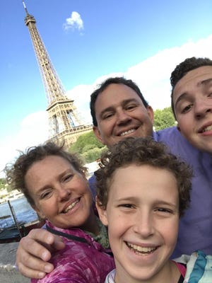 Eanes school district trustee Julia Cook Webber, her husband and two sons are moving to France next month. [Contributed photo]