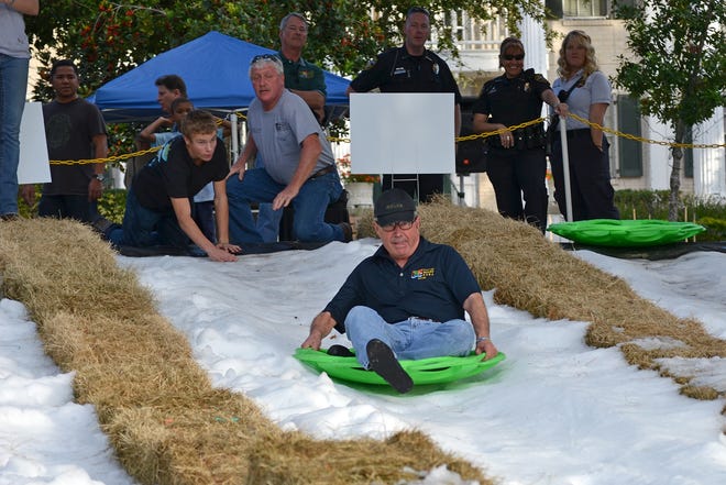 A man tests out the sledding at Donnelly Park in Mount Dora. The annual Children's Christmas in the Park with Snow from 5 to 9 p.m. on Saturday. [City of Mount Dora]
