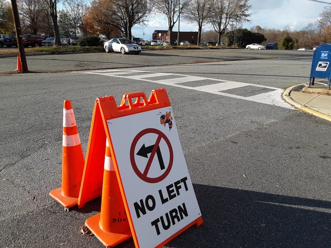 A no-left-turn sign is placed at the exit of the circle at Lexington Middle School in an effort to address safety issues in the area. [Sharon Myers/The Dispatch]
