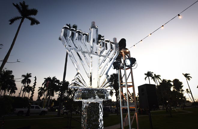 The ice sculpture as seen at the annual community-wide Hanukkah celebration Sunday at Bradley Park before it fell and shattered. [Melanie Bell/palmbeachdailynews.com]