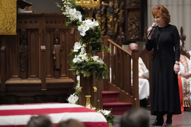 Reba McEntire sings "The Lord's Prayer" during a funeral service for former President George H.W. Bush at St. Martin's Episcopal Church Thursday, Dec. 6, 2018, in Houston. (AP Photo/David J. Phillip, Pool)