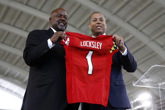 Maryland's new head football coach Mike Locksley, left, and athletic director Damon Evans pose during an news conference Thursday in College Park, Md. Locksley, Alabama's offensive coordinator, will take over at Maryland after the most tumultuous year in the program's recent history. [The Associated Press]