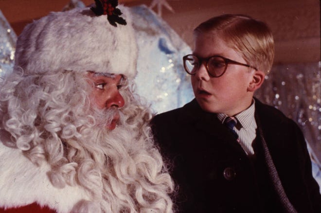 Ralphie (Peter Billingsley) visits a department store Santa (Jeff Gillen) as part of his campaign to find a BB gun under his tree in the classic holiday film 'A Christmas Story.' (Photo credit: MGM)