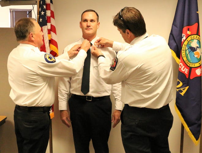 Lake County Fire Rescue celebrates Carter Cork being promoted to the rank of lieutenant on Friday. [SUBMITTED]