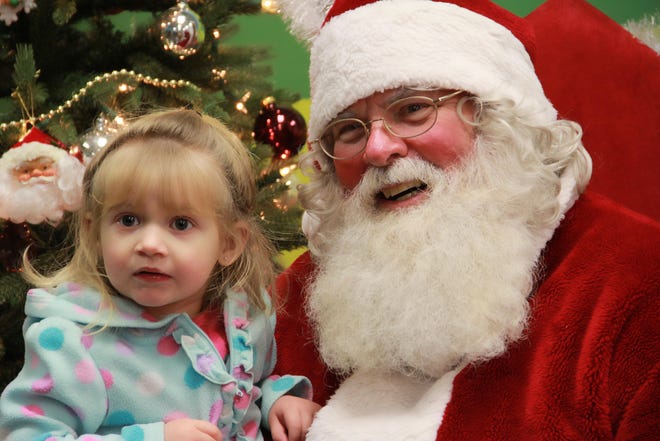 Children can meet Santa during ZooLights and during Dinner with Santa events at Binder Park Zoo. [Contributed]