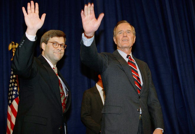FILE - In this Nov. 26, 1991, file photo, President George H.W Bush, right, and William Barr wave after Barr was sworn in as the new Attorney General of the United States at a Justice Department ceremony in Washington. Barr, who served as attorney general under Bush, has emerged as a top contender for that job in President Donald Trump's Cabinet, two people familiar with the president's selection process said Thursday, Dec. 6, 2018. (AP Photo/Scott Applewhite, File)