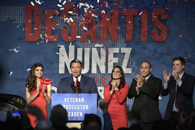 Florida Gov.-elect Ron DeSantis, second from left, thanks supporters with his wife, Casey, left, Lt. Gov.-elect Jeanette Nunez, center; her husband, Adrian Nunez, second from right, and Rep. Matt Gaetz, R-Fla., after being declared the winner of the Florida gubernatorial race at an election party Tuesday, Nov. 6, 2018, in Orlando. [AP Photo/Phelan M. Ebenhack]