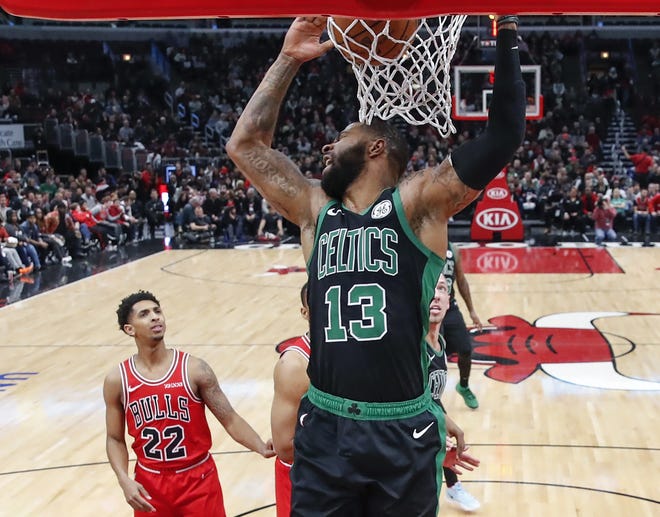 Boston Celtics forward Marcus Morris dunks against the Chicago Bulls on Saturday in Chicago. [Kamil Krzaczynski/Associated Press]