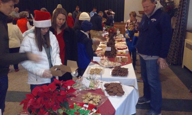 People enjoy the seventh annual St. Mary's Cookie Walk for good causes. [Photo/Free Press]