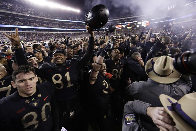 Army players celebrate after defeating Navy 17-10 in an NCAA college football game Saturday in Philadelphia. [AP Photo/Matt Slocum]