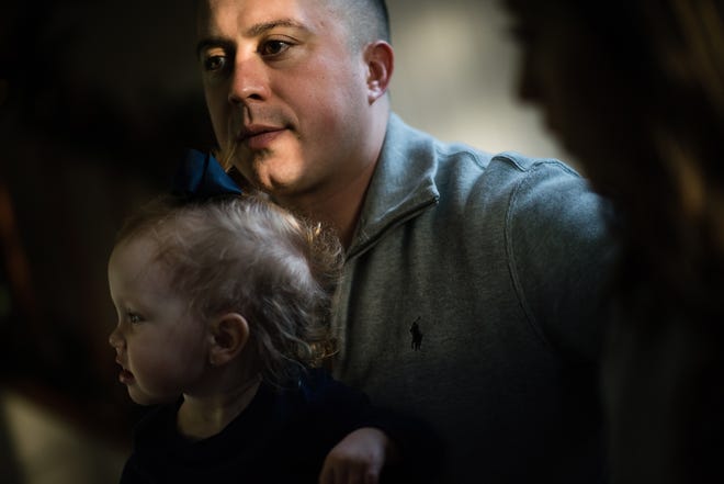 Andres Martin, a 31-year-old Marine, is being treated at Walter Reed National Military Medical Center for a rare form of Alzheimer's disease that impacts people with roots in Jalisco, Mexico. He worries his daughter, Alexis, who is not yet 2, will also have it. [ SARAH L. VOISIN / THE WASHINGTON POST ]
