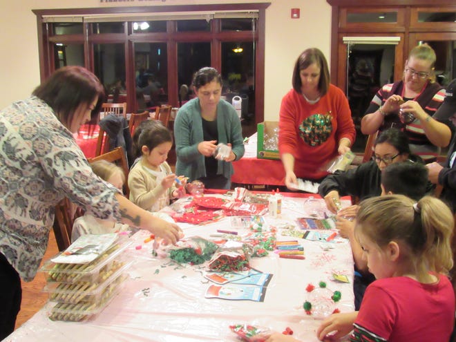 Kids Kicking Cancer Support Program participants engage in festive activities at the annual KKC Christmas Party. KKC is an activity-based support group for children affected by cancer that meets year round at the Reynolds Cancer Support House. [Photo courtesy Reynolds Cancer Support House]