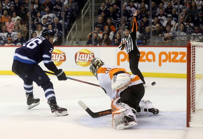 Blake Wheeler scores a shorthanded goal during the second-period of the Jets 7-1 win against the Flyers in Winnipeg. Trevor Hagan / The Canadian Press via Associated Press