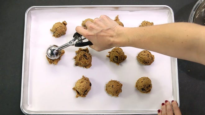 TINA PHAN/AMERICAN-STATESMAN. 5/24/16. Chilled dough is scooped and ready to be topped with salt then baked. For this month's year of baking project, Statesman food writer Addie Broyles makes salted chocolate chunk cookie ice cream sandwiches in the Statesman studio on Tuesday, May 24, 2016.