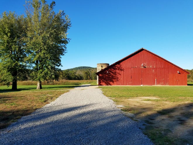 The barn at Alvin C. York State Historic Park in Pall Mall, Tenn., is typical of barns in North Central Tennessee, punctuating the Cumberland Mountains with a splash of red. [Contributed by Helen Anders]