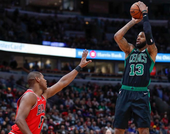 Boston forward Marcus Morris shoots over Chicago forward Cristiano Felicio during the second half of a game on Saturday. Morris has been a vocal leader of the “Bench-With-Attitude” mantra for the Celtics this year.