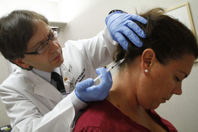For decades, doctors treated migraines with blood pressure medication, anti-seizure drugs, anti-depressants and even Botox, as in this 2010 photo. [JOSHUA LOTT/THE NEW YORK TIMES]