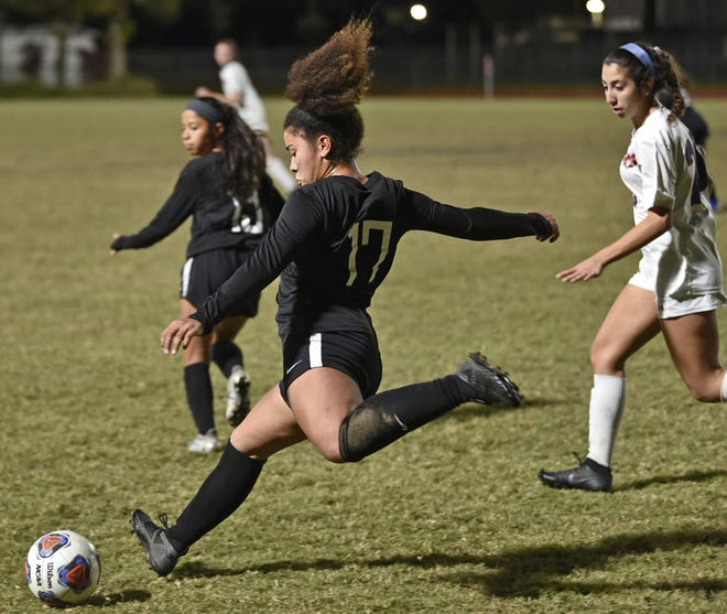 Lakewood Ranch High's Hajar Benjoud (17) passes the ball down field against Manatee High on Tuesday at the Lakewood Ranch High School stadium. [Herald-Tribune staff photo / Thomas Bender]