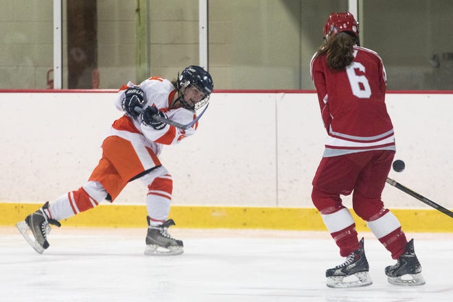 Newton senior Abigail Dobies attempts to score a point during the game against Waltham at Veterans Rink in Waltham. [Wicked Local Staff Photo/Ruby Wallau]