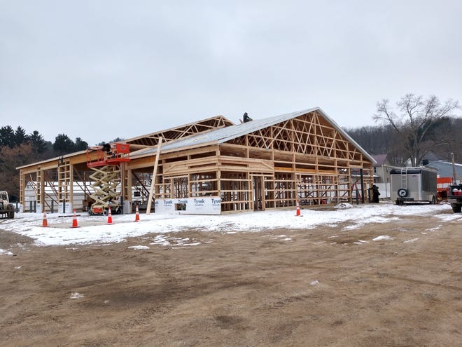 Workers brave frigid temperatures last Monday, Dec. 10, to put the Loudonville Maintenance Building under roof. The project should be complete by the end of winter.