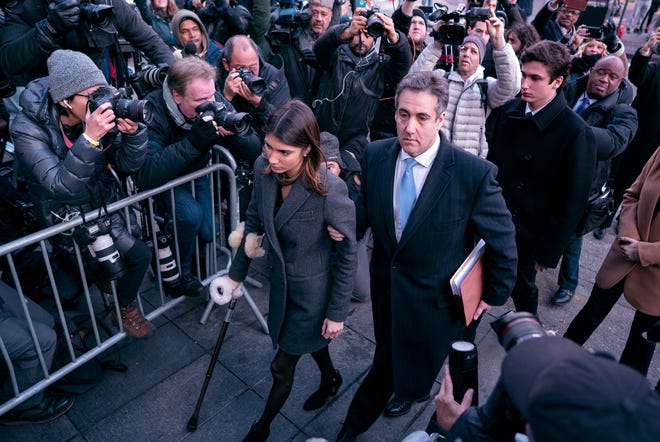 Michael Cohen, center, President Donald Trump's former lawyer, accompanied by his children Samantha, left, and Jake, right, arrives at federal court for his sentencing Wednesday in New York, for dodging taxes, lying to Congress and violating campaign finance laws. [AP Photo/Craig Ruttle]