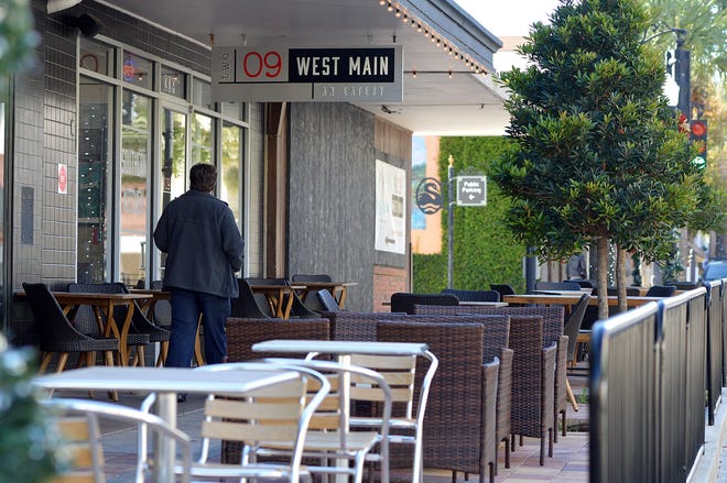 Two 09 West Main features table and chairs on the sidewalk near the bulding and in a bump out-style patio in downtown Leesburg. [Whitney Lehnecker/Daily Commercial]