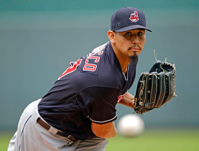 FILE - In this Sept. 30, 2018, file photo, Cleveland Indians starting pitcher Carlos Carrasco throws during the first inning of a baseball game against the Kansas City Royals in Kansas City, Mo. The Indians have signed Carrasco to a new, four-year contract through the 2022 season. Carrascoâ€™s deal includes a club option for 2023. Financial terms of the contract were not immediately available. (AP Photo/Charlie Riedel, File)