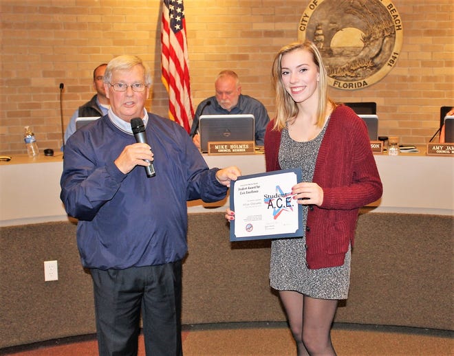 Allison Oldnettle of Choctawhatchee High School receives The Award for Civic Excellence from Fort Walton Beach Mayor Dick Rynearson Tuesday. [CONTRIBUTED PHOTO]