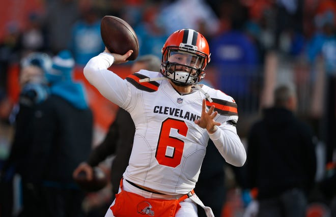 FILE - In this Dec. 9, 2018, file photo, Cleveland Browns quarterback Baker Mayfield warms up before an NFL football game against the Carolina Panthers, in Cleveland. As Baker Mayfield threw passes to his receivers and backs before Sunday’s game against Carolina, Browns interim coach Gregg Williams knew his rookie quarterback was going to have a good game. It wasn’t anything Williams saw. It was a sound. (AP Photo/Ron Schwane, File)