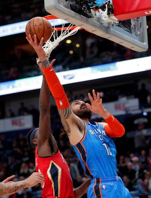 Oklahoma City Thunder center Steven Adams goes to the basket Wednesday against New Orleans Pelicans forward Julius Randle. [AP Photo]