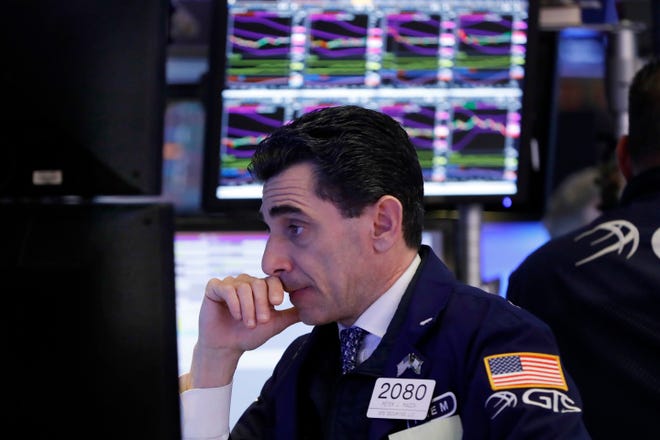 Specialist Peter Mazza works at his post on the floor of the New York Stock Exchange. [AP file photo]