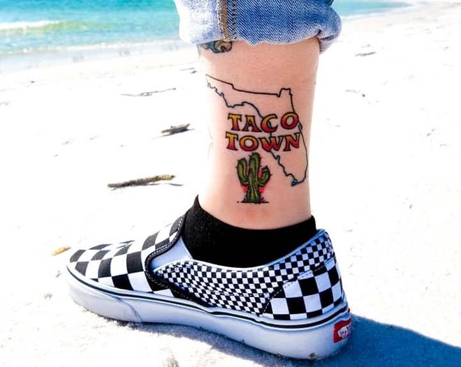 Melissa Nettles, a Fort Walton Beach native and tattoo artist, recently had her favorite hometown restaurant, Taco Town, tattooed on her leg. [CONTRIBUTED PHOTO]