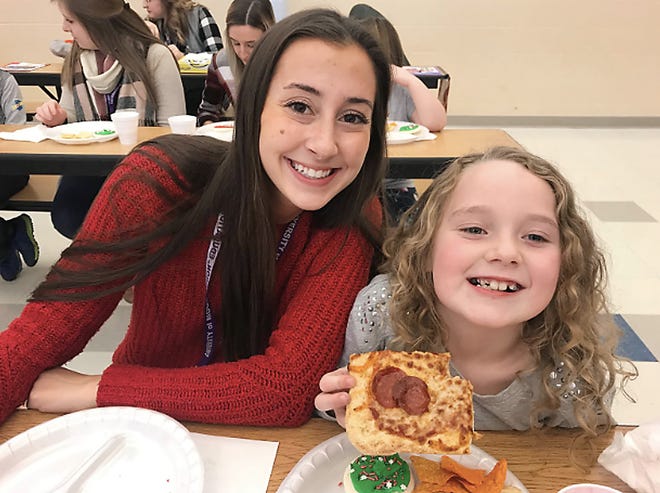 Mount Union students enjoyed a pizza party at Rockhill to celebrate the end of their classes that led them to help out the elementary school students.