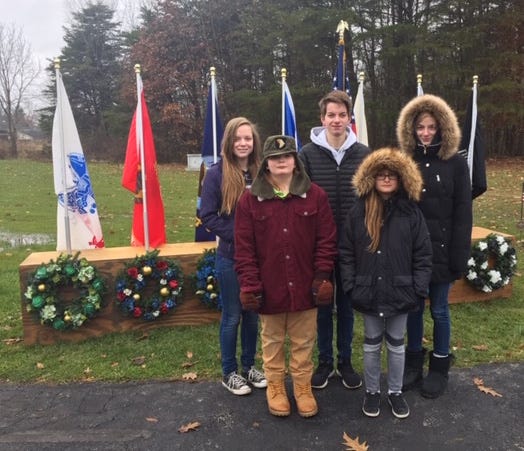 Rangers 4-H Club Members helped to lay wreaths on veterans' graves at Berlin Township Cemetery. The members also played Taps in a ceremony. On hand were, front row, Ivan Huber and Micky Salovich; and, back row, Olivia Reph, Will Reph and Emma Reph.