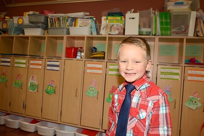 Lucas Janosik, a kindergarten student at Damascus Elementary School, stands in front of the student cubbies in his classroom on Monday, Dec. 10, 2018. Lucas was nominated for this week's Make the Grade award by his teacher, Treva Cline.