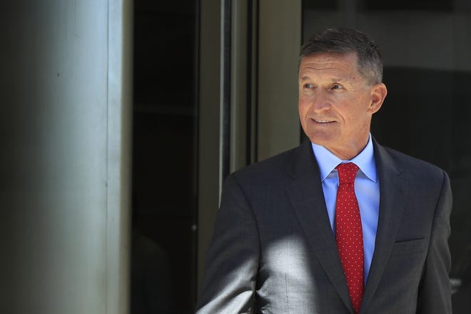 In this Tuesday, July 10, 2018 file photo, former Trump national security adviser Michael Flynn leaves federal courthouse in Washington, following a status hearing. Flynn is relaxed and hopeful even as the possibility of prison looms when he's sentenced in the Russia probe Tuesday, Dec. 18, 2018. The retired three-star general pleaded guilty last year to lying to the FBI about conversations he had with the then-Russian ambassador to the U.S. during President Donald Trump's White House transition. (AP Photo/Manuel Balce Ceneta, File)